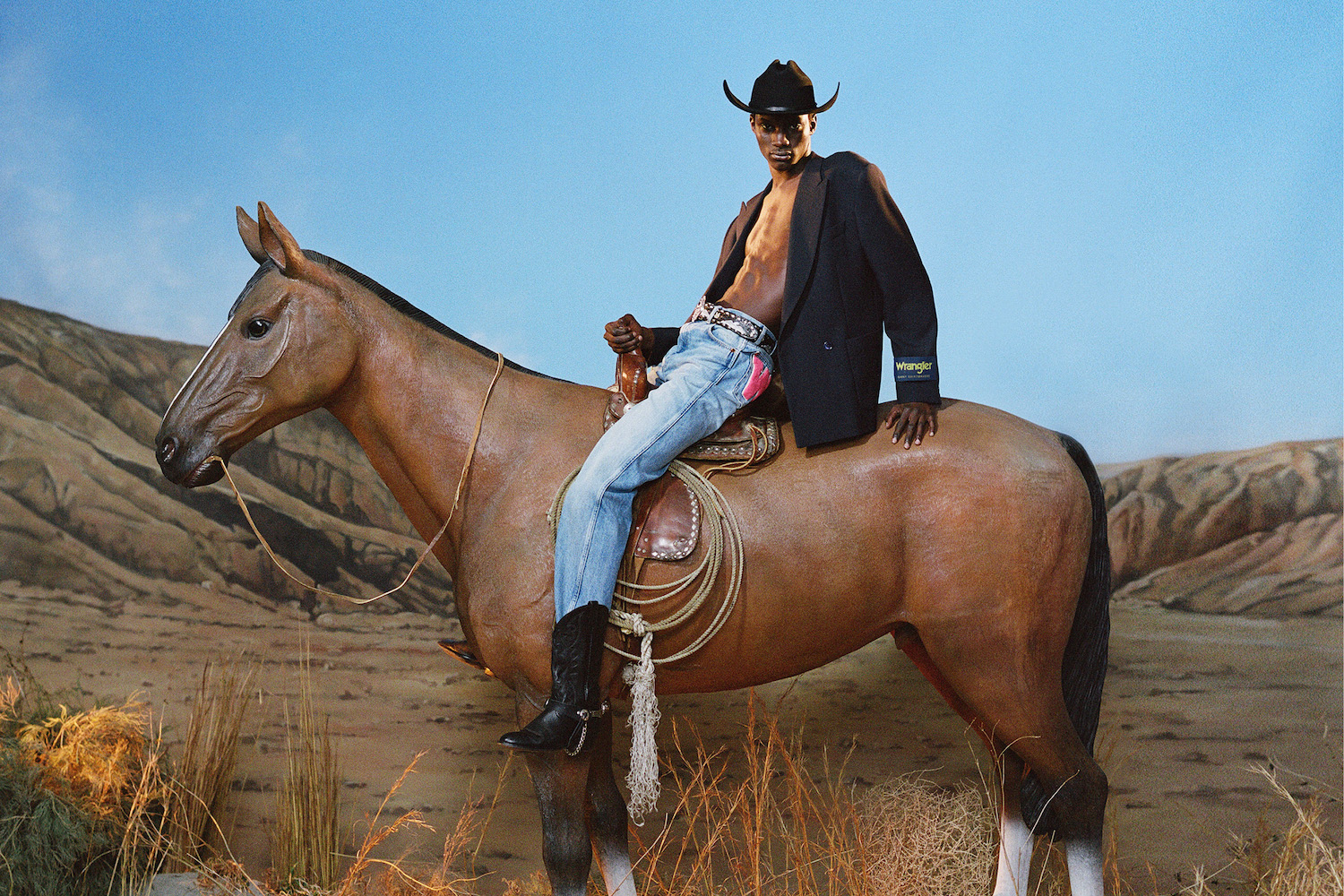 a model on a horse in the GANT x Wrangler collection