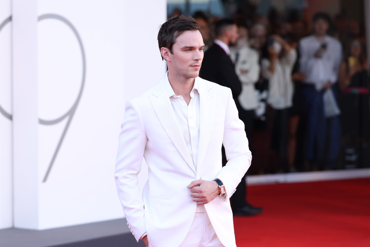 A red carpet photo of actor Nicholas Hoult at the 79th International Venice Film Festival