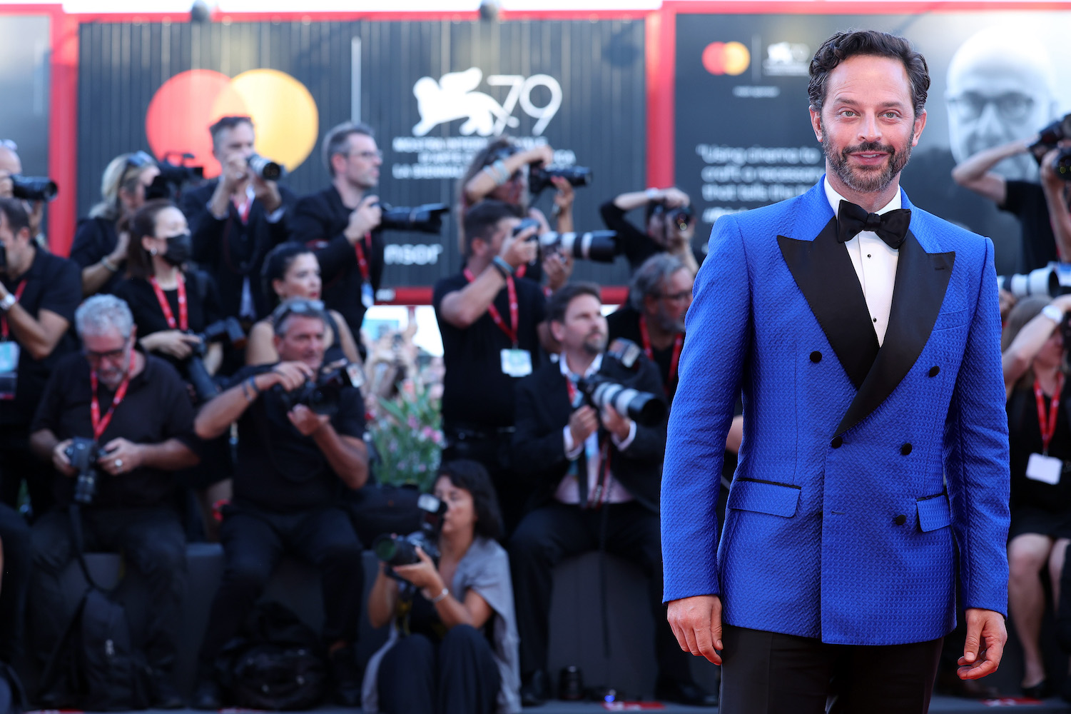 A red carpet photo of actor Nick Kroll at the 79th International Venice Film Festival