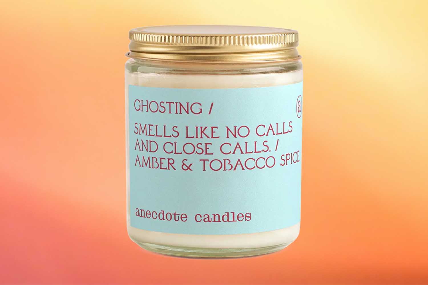 Ghosting by Antidote Candles, one of the best fall candles for 2022 on an orange background