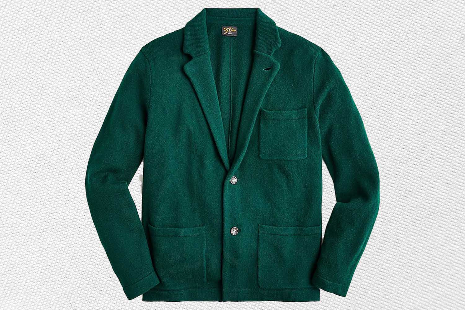 a green cashmere sweater blazer from J.Crew on a grey background