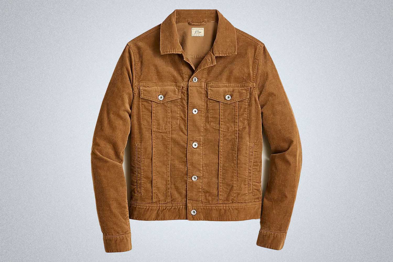 a brow corduroy jacket from J.crew on a grey background