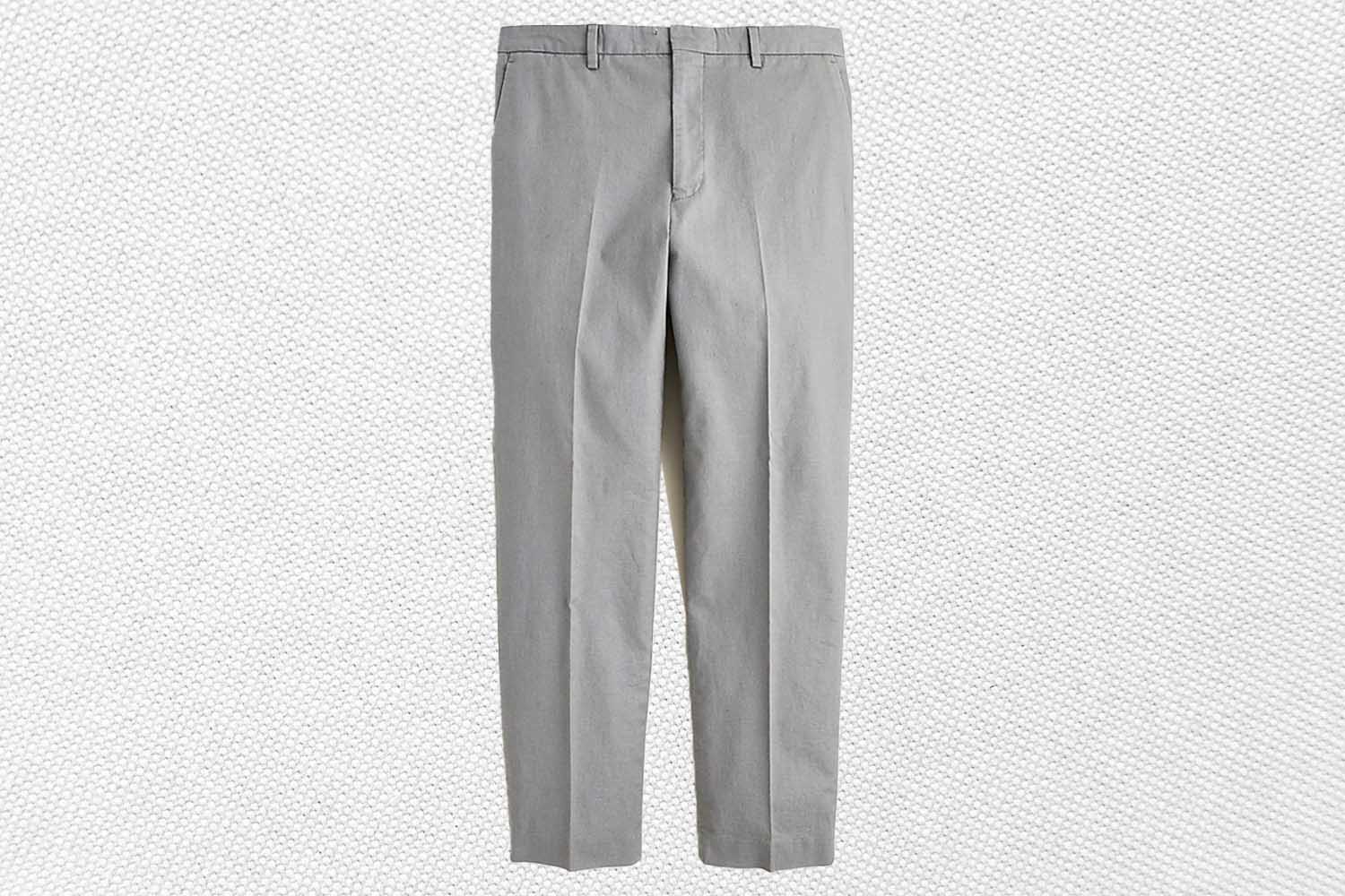 a pair of grey suit pants from J.Crew on a grey background