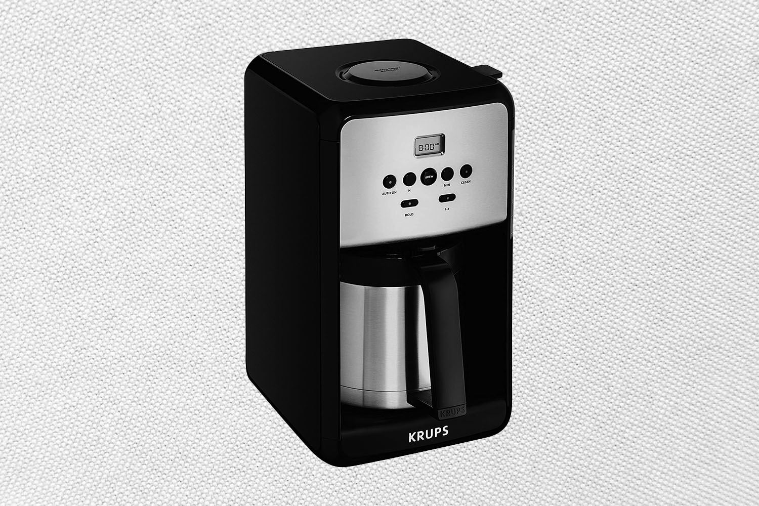 The KRUPS ET351 Coffee Maker on a white patterned background