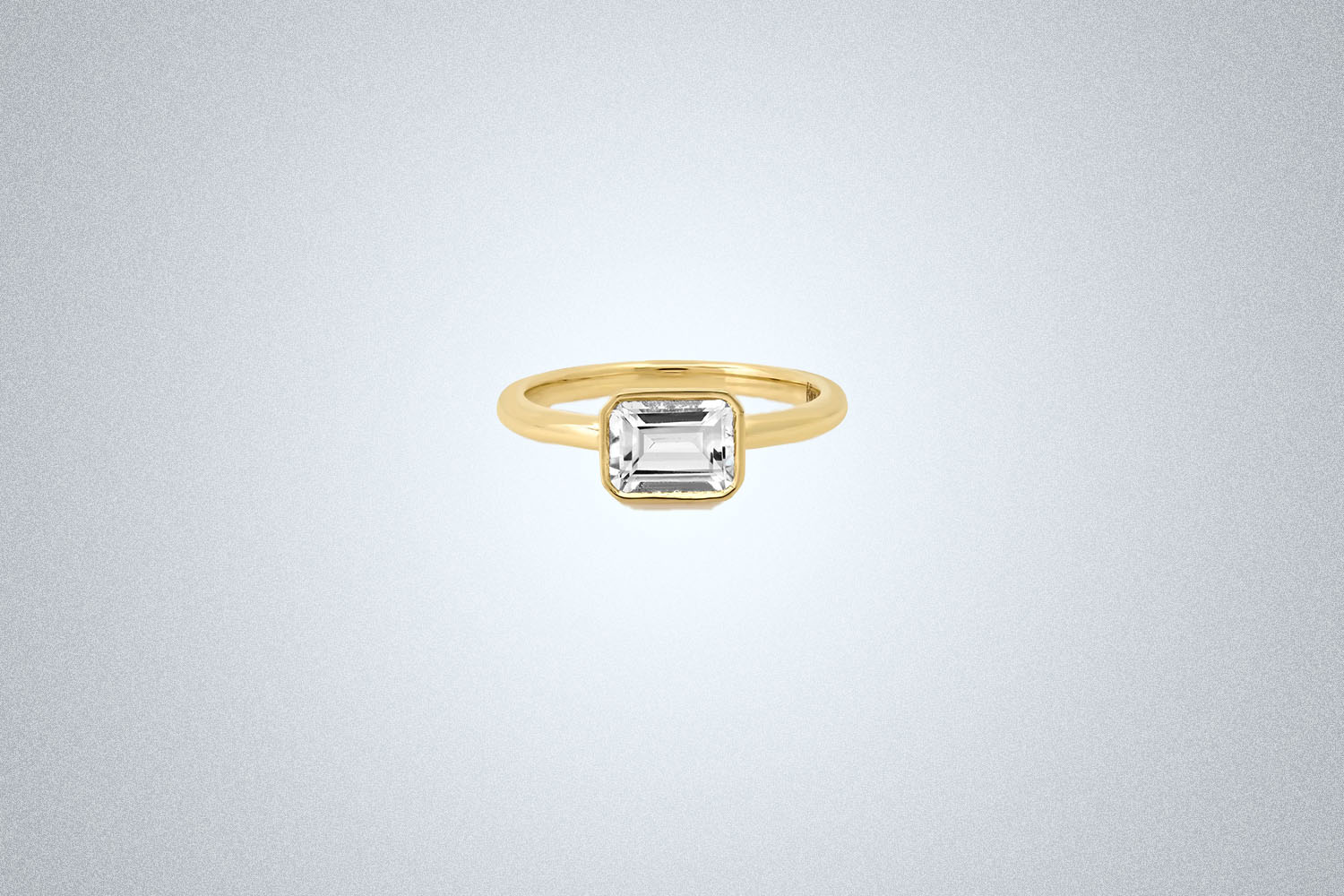 A Kinn The Sophia Engagement Ring on a gray background