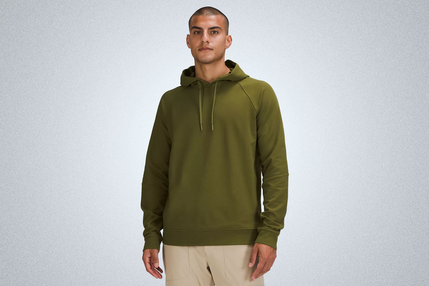 a green hoodie from the lululemon we've made too much sale on a model on a grey background