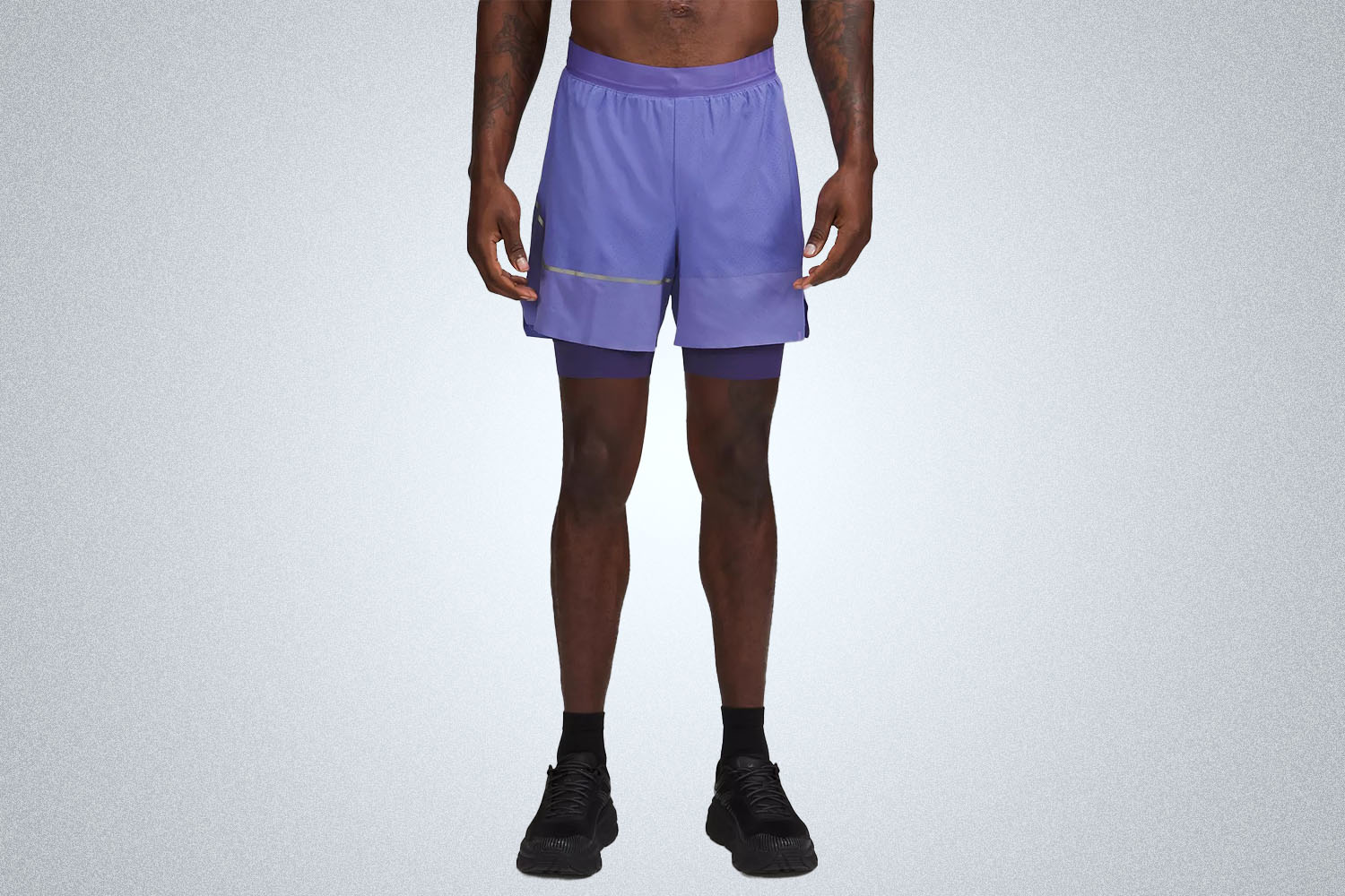 a pair of purple shorts from the lululemon we've made too much sale on a model on a grey background