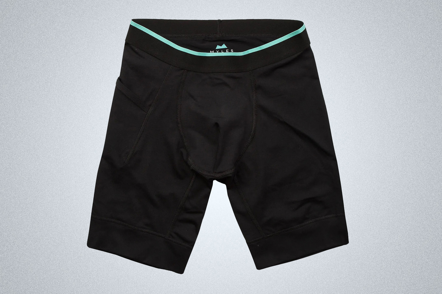 a pair of black compression shorts from the Myles Apparel Sale on a grey background