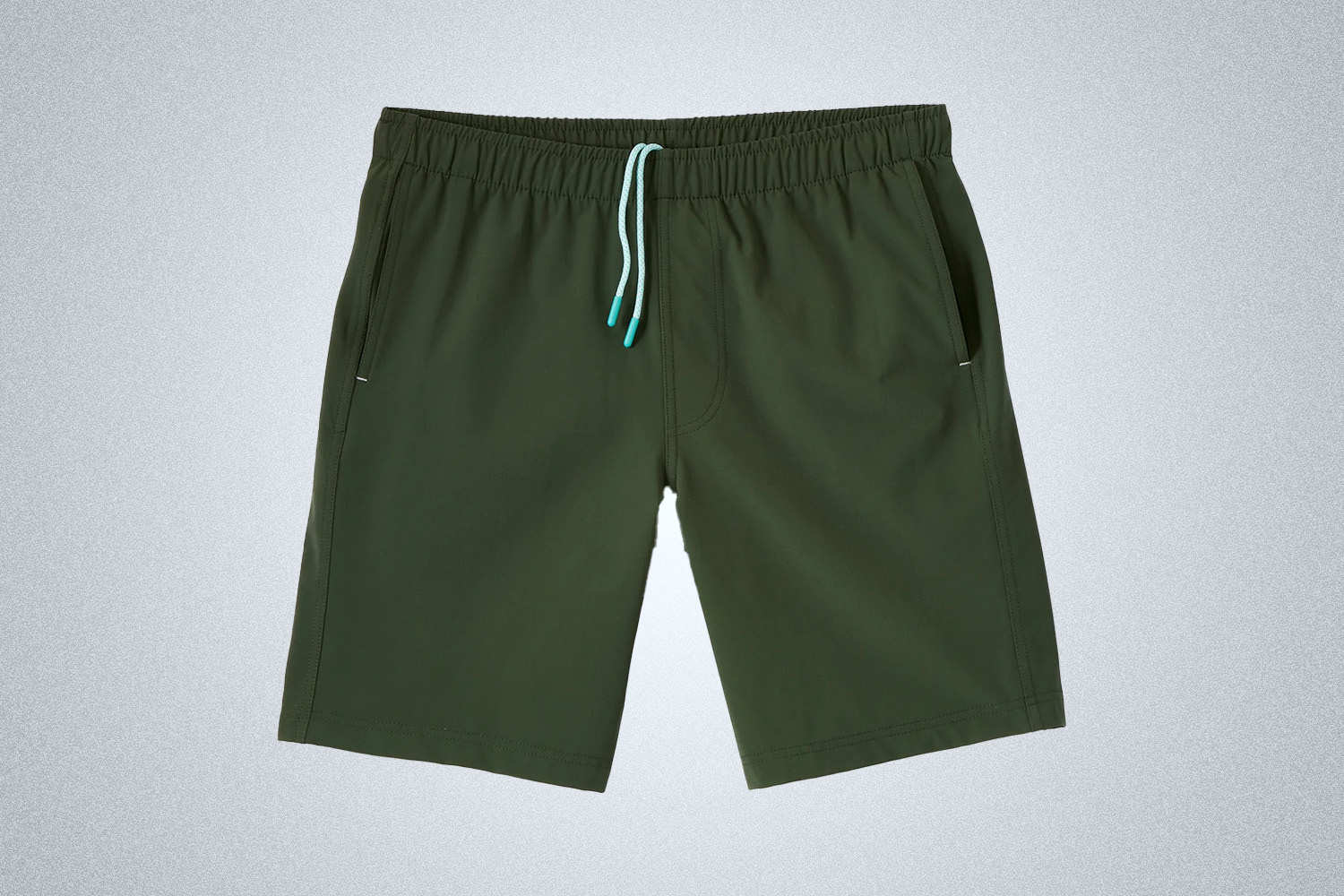 a pair of green shorts from Myles Apparel on a grey background