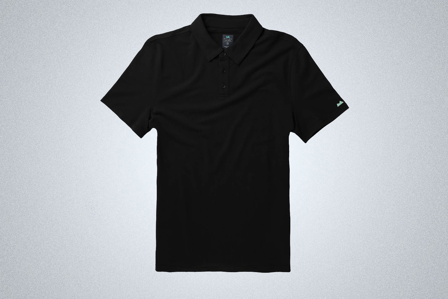 a black short sleeve polo from Myles Apparel on a grey background