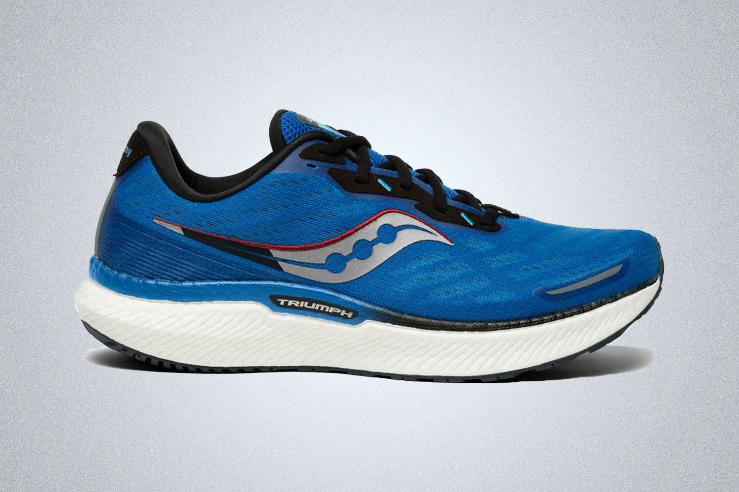 a blue and white cushioned running shoe from Saucony on a grey background