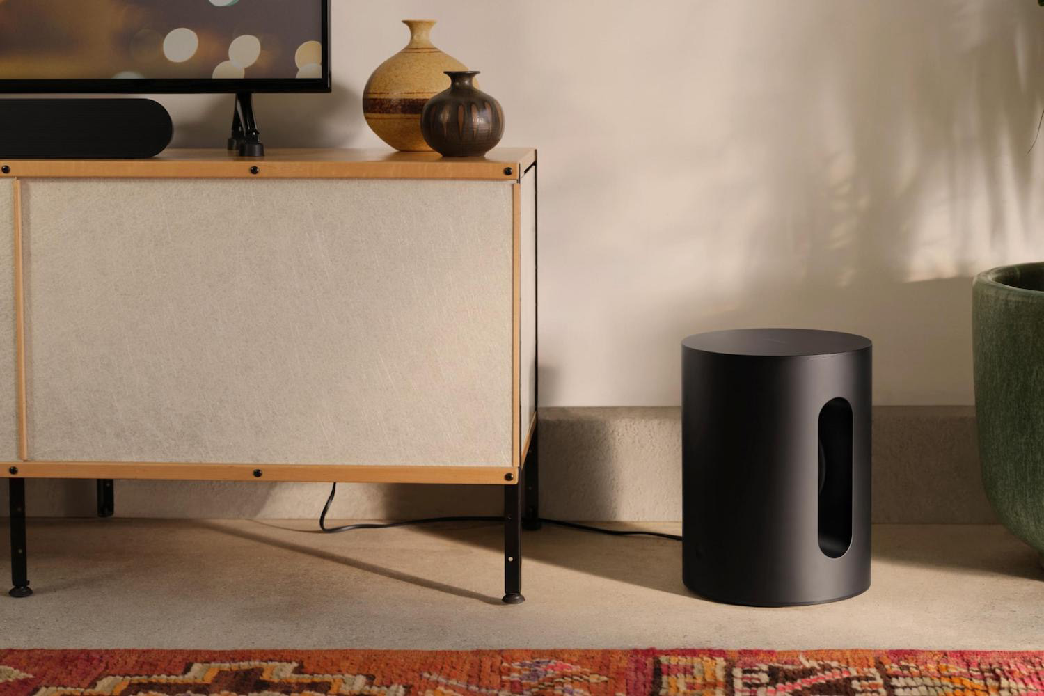 a Sonos Sub Mini speaker in a house setting