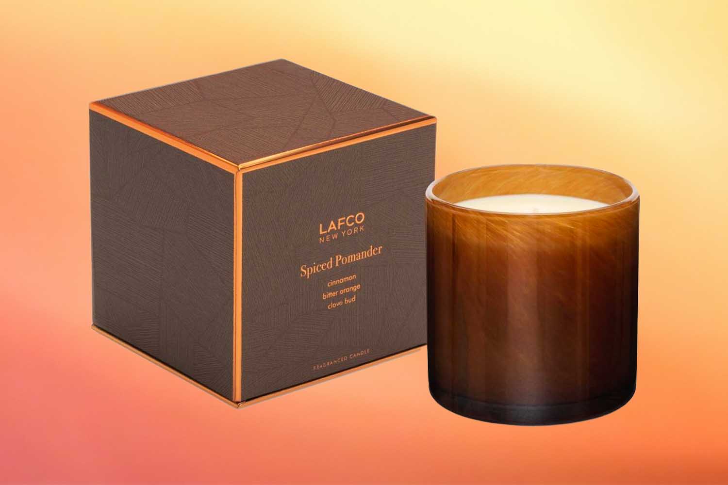 LAFCO Spiced Pomander candle, ne of the best fall candles for 2022 on an orange background
