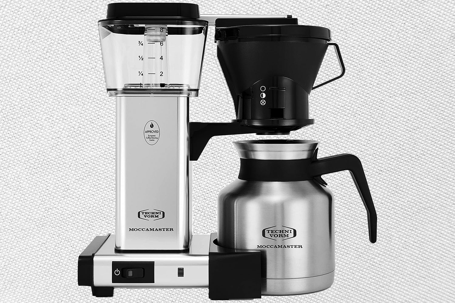 A Technivorn Moccamaster Coffee Brewer on a gray and white background