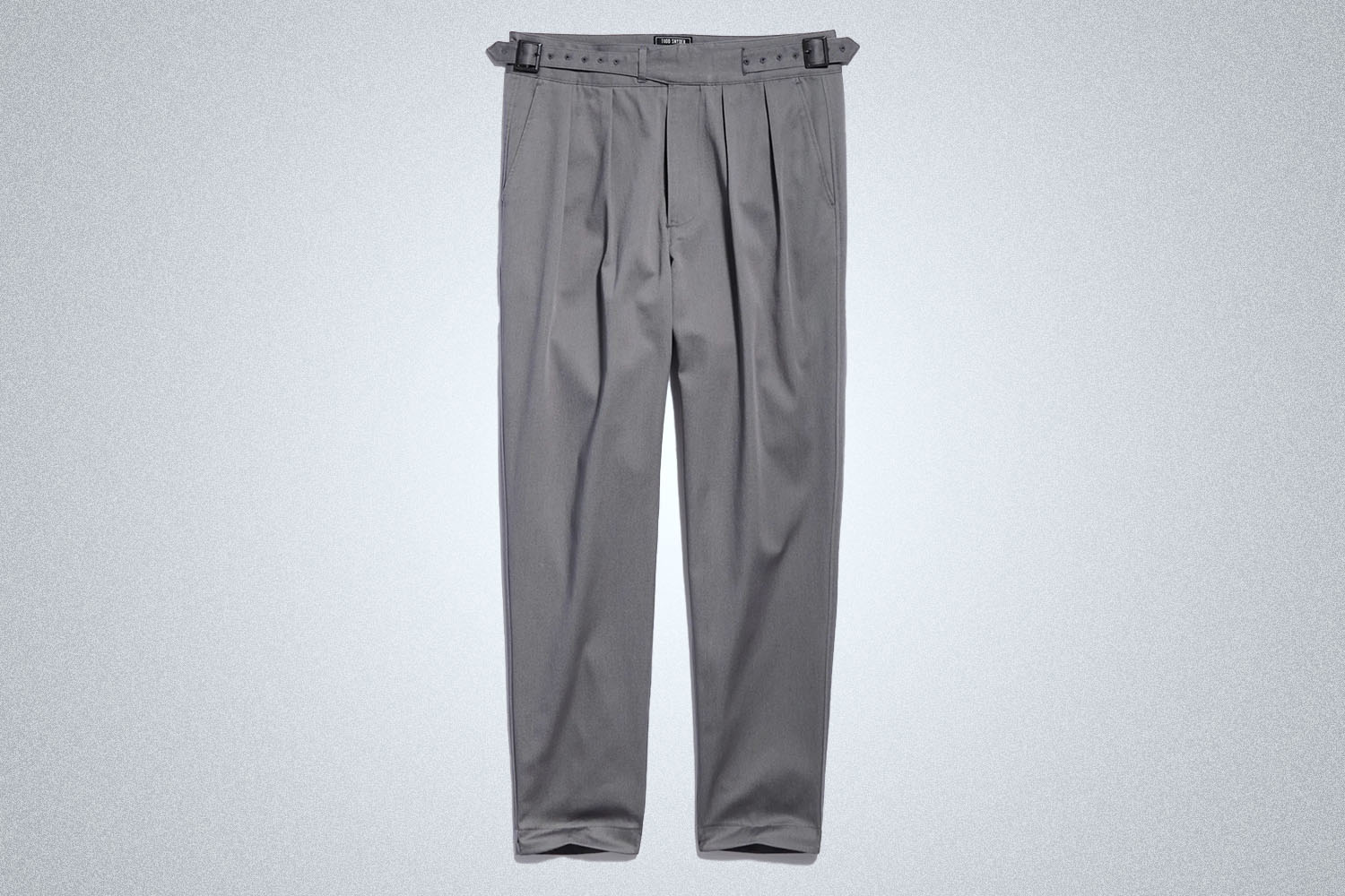 a pair of grey Gurkha style pants from Todd Snyder on a grey background