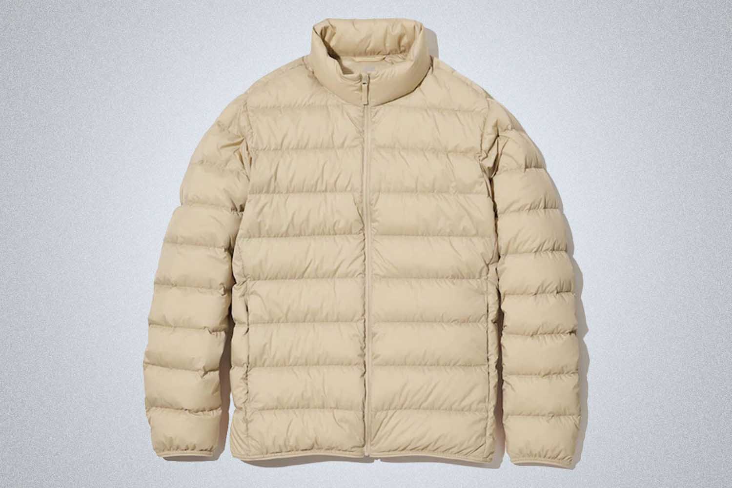 a off-white down jacket from Uniqlo on a grey background