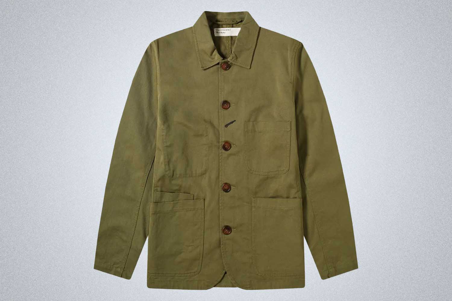 a green lightweight jacket from Universal Works on a grey background