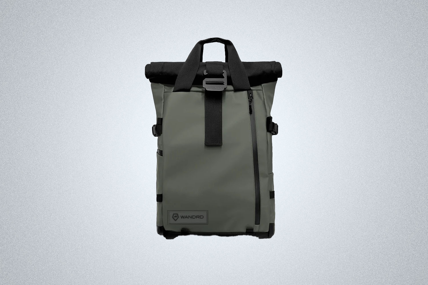 The Wandrd PRVKE 31L in a green color way on a gray background