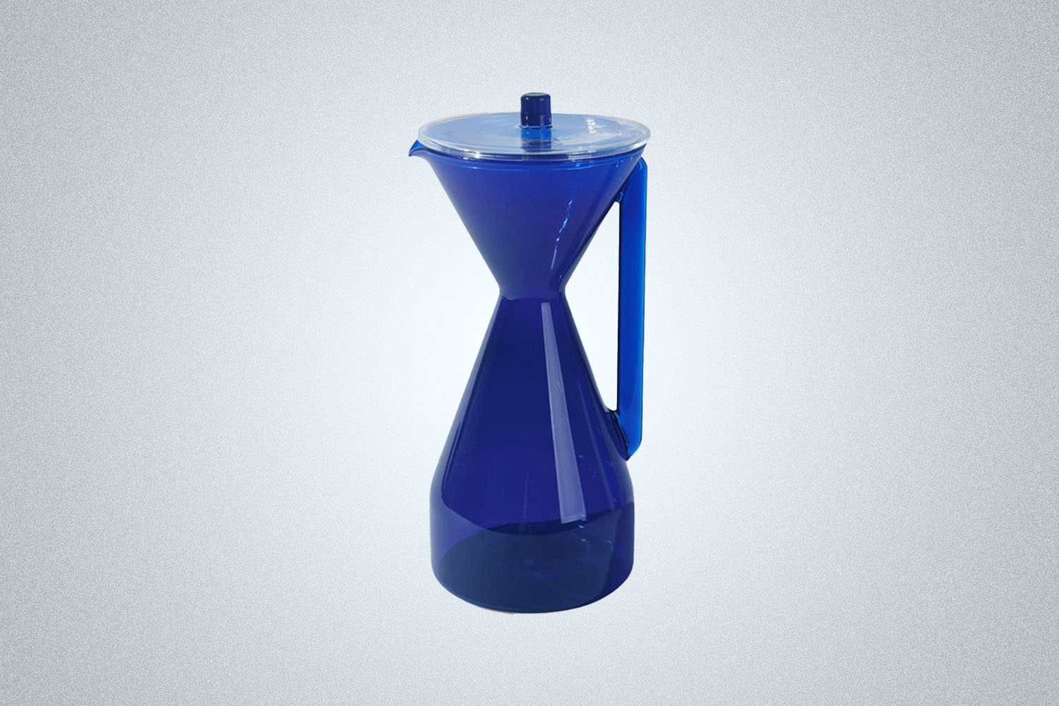 The Yield Pour-Over Glass Coffee Carafe in blue on a gray background