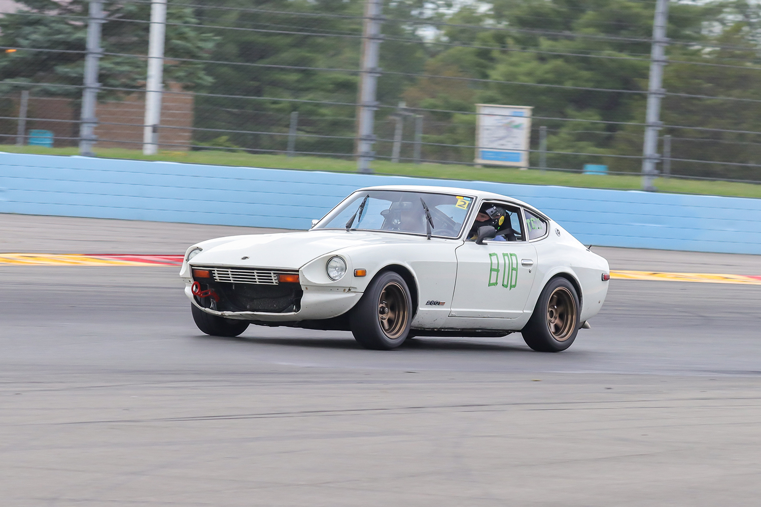 Automotive writer Benjamin Hunting drives his 1978 Datsun 280Z on the road course at Watkins Glen