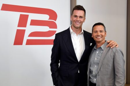 TB12 co-founders Tom Brady and Alex Guerrero celebrate the opening of a TB12 Center in 2019.