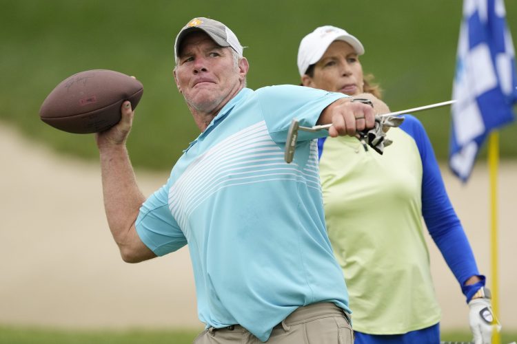 Ex-NFL player Brett Favre throws a football at the American Family Insurance Championship. His welfare scandal is growing with new information about donations from Favre 4 Hope.
