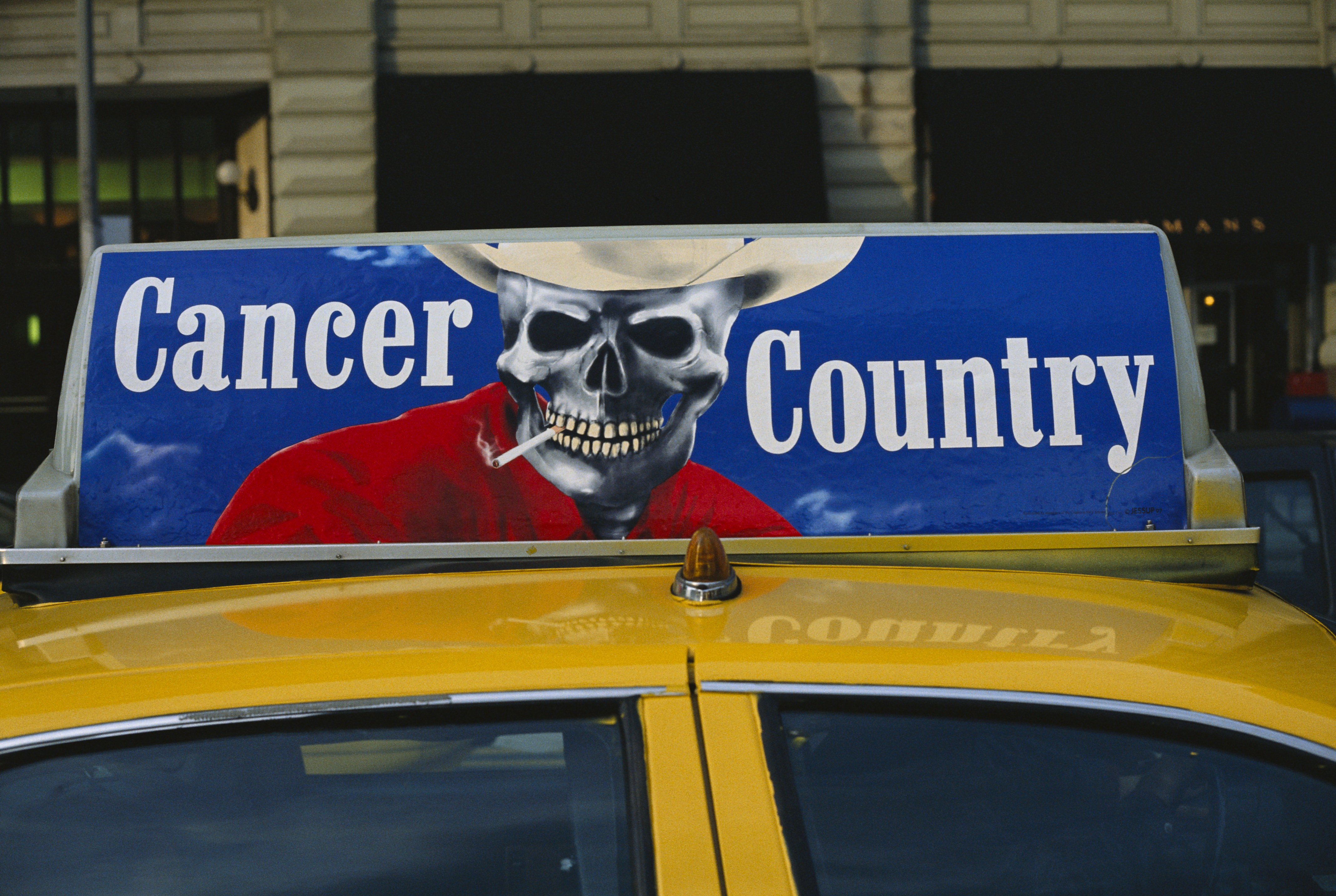 A taxicab with an anti-smoking advertisement.