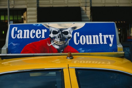 A taxicab with an anti-smoking advertisement.