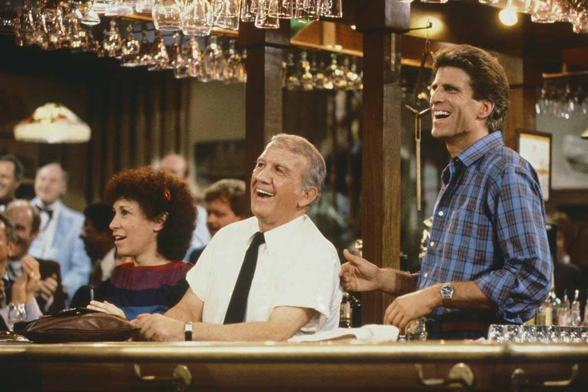 "Friends, Romans & Accountants" Episode 7 -- Pictured: (l-r) Rhea Perlman as Carla Tortelli, Nicholas Colasanto as Ernie 'Coach' Pantusso, Ted Danson as Sam Malone on the TV show "Cheers," which debuted on NBC 40 years ago.