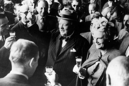 26th August 1946: Former British prime minister Winston Leonard Spencer Churchill (1874 - 1965) and his wife Clementine make a toast upon their arrival in Switzerland.