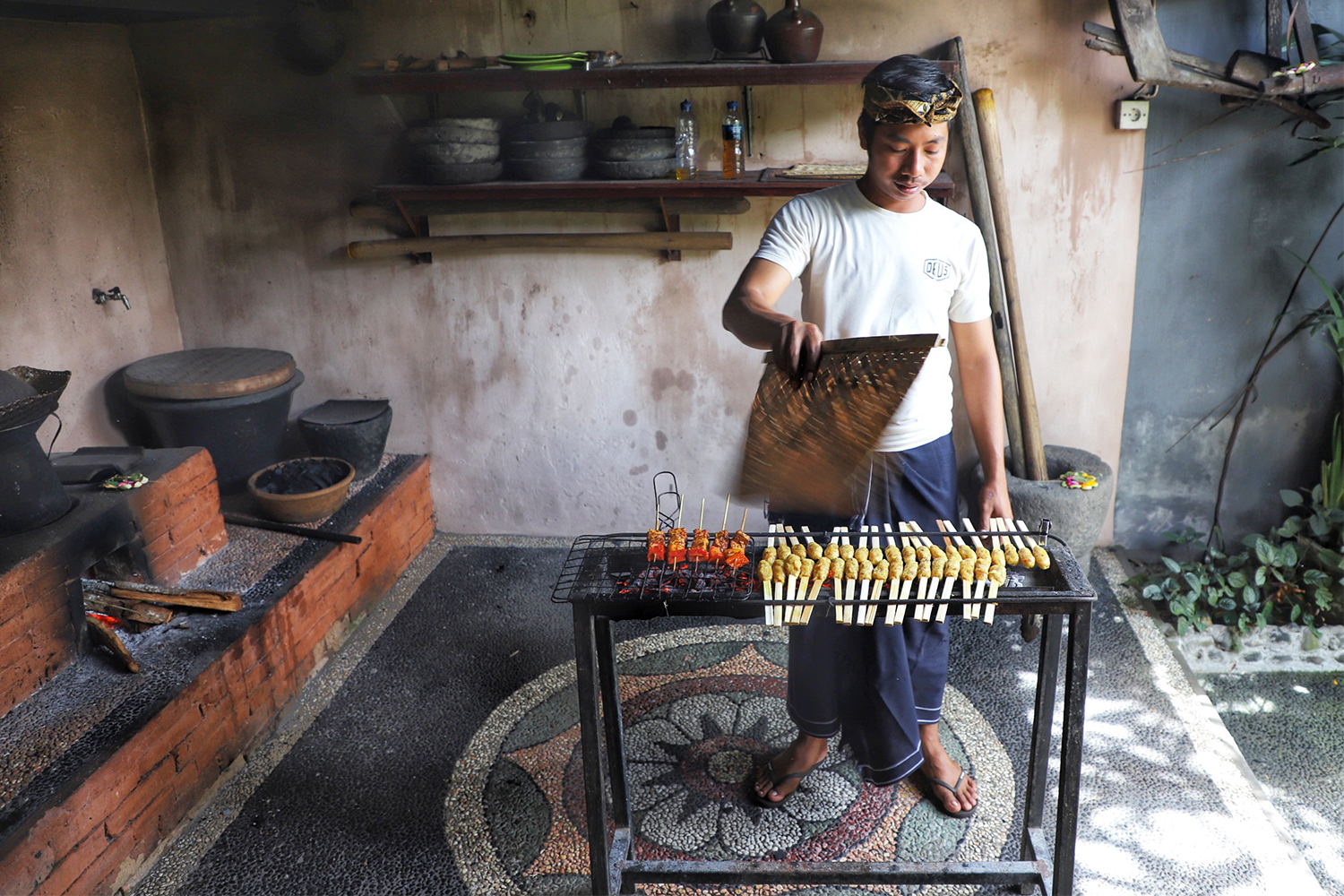 A man running a cooking class for tourists in Bali, Indonesia