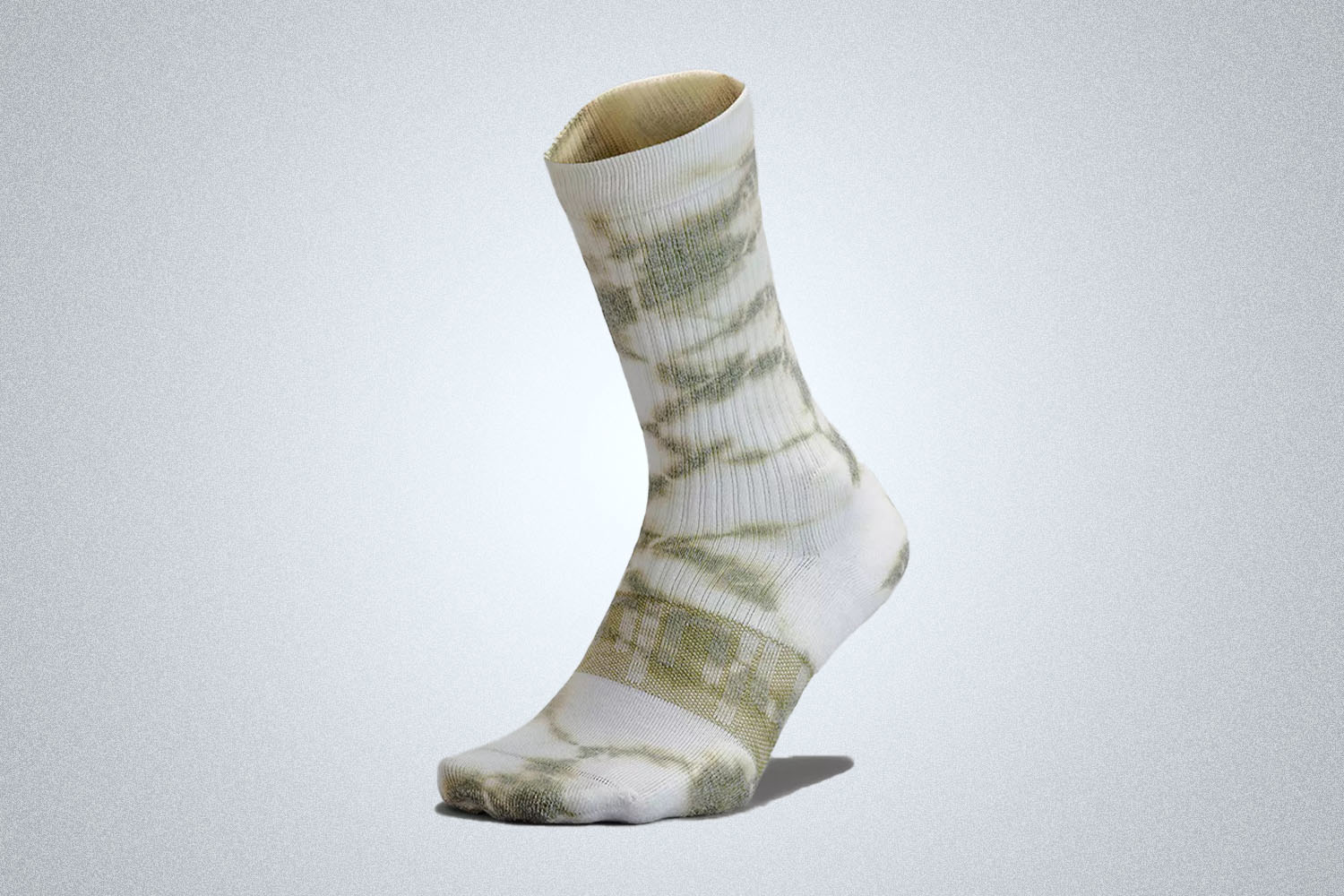 a green tie-dye sock from the lululemon we've made too much sale on a grey background