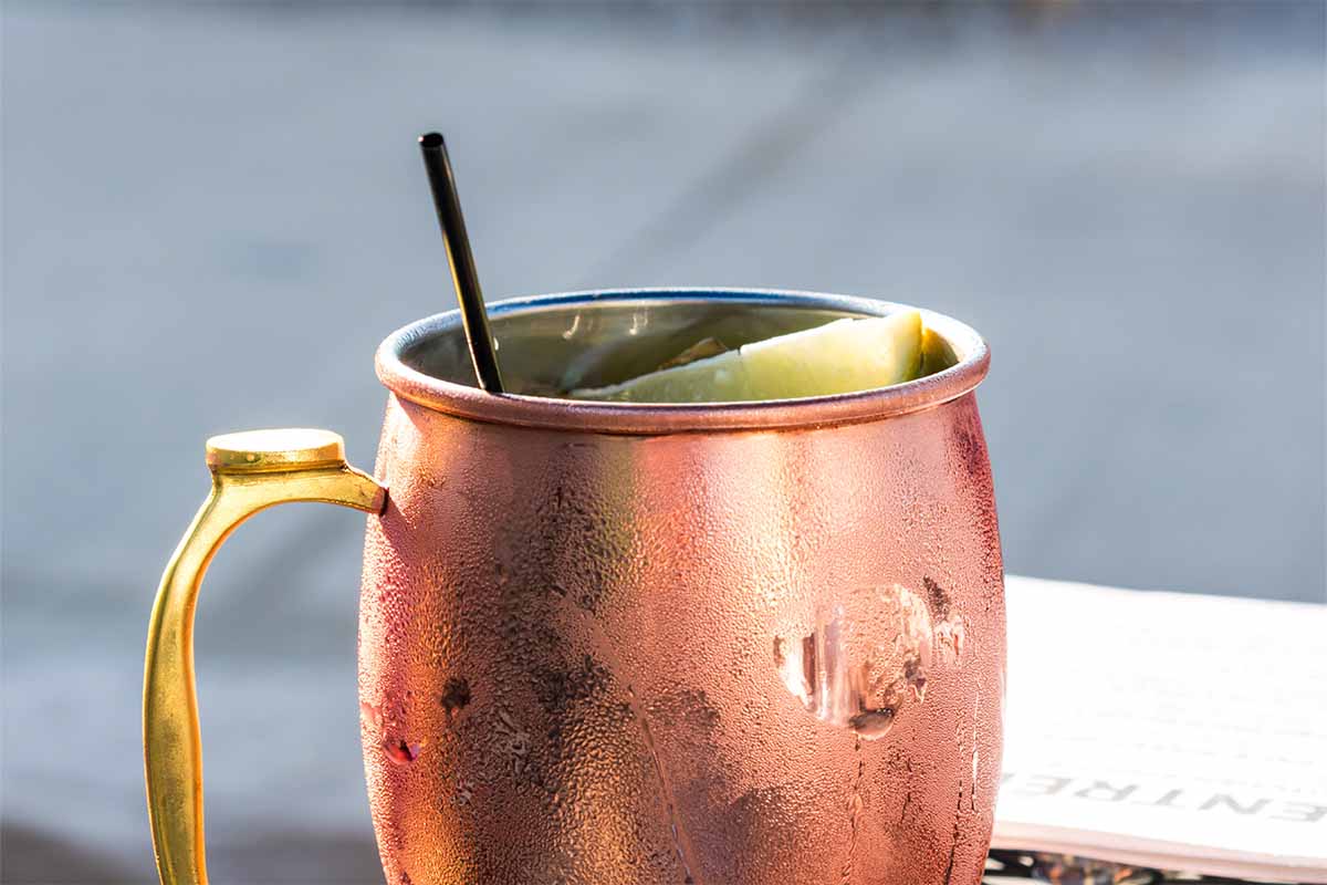 Closeup Of A Moscow Mule Mixed Drink In A Copper Mug - stock photo. The Moscow Mule is a simple cocktail that can be enhanced with a few simple hacks.