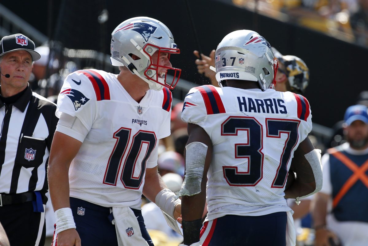 Damien Harris and Mac Jones of the Patriots celebrate after a touchdown