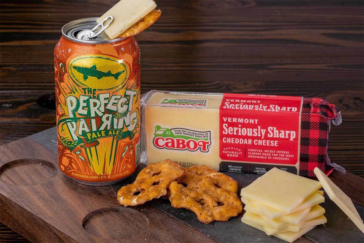 The Perfect Pairing beer with Cabot cheese and some snacks on a table