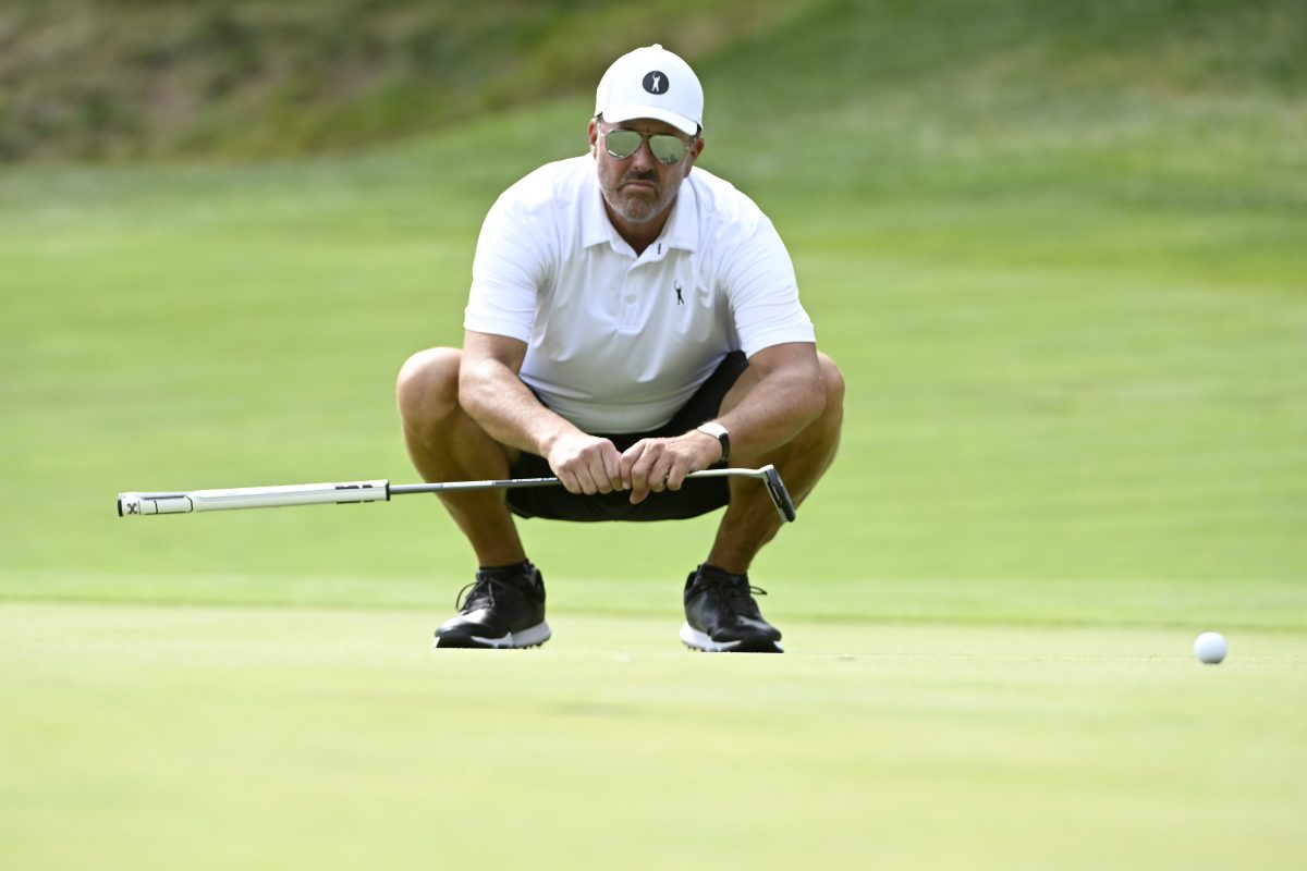 Phil Mickelson lines up a putt at the LIV Golf Invitational Boston