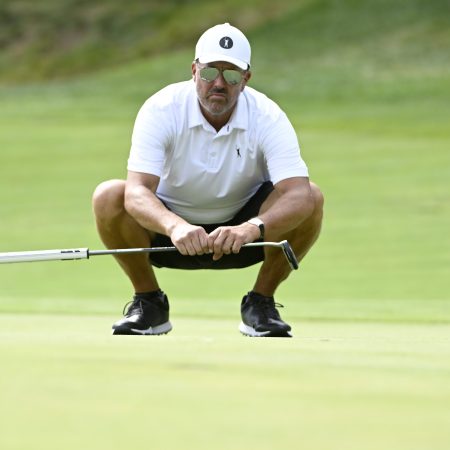 Phil Mickelson lines up a putt at the LIV Golf Invitational Boston