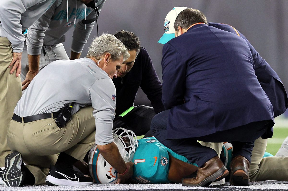 Medical staff tend to quarterback Tua Tagovailoa of the Miami Dolphins