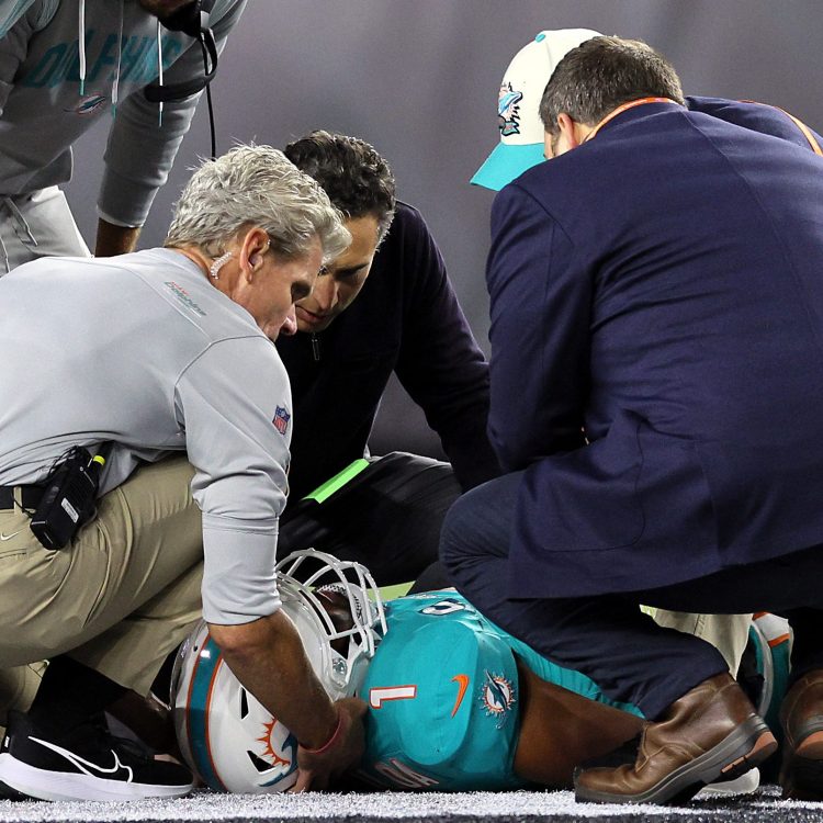 Medical staff tend to quarterback Tua Tagovailoa of the Miami Dolphins
