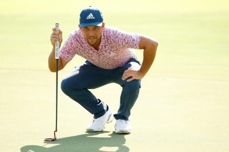 Xander Schauffele putt on the 18th green at the TOUR Championship.