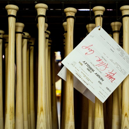 A row of Louisville Slugger baseball bats. The iconic ash bats are less popular than maple for a couple reasons.