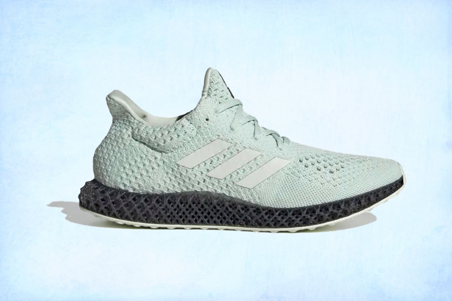 a pair of teal Adidas 4D Futurecraft sneakers on a light blue background