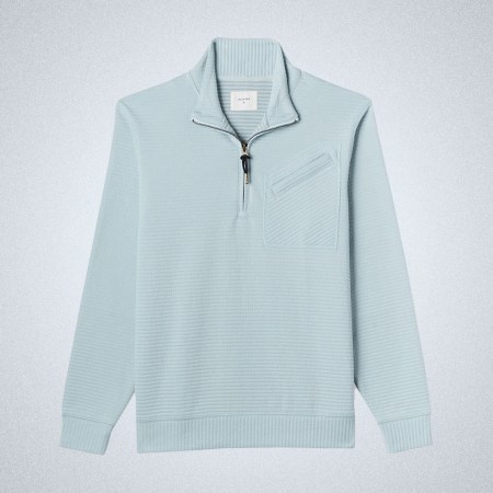 a blue half-zip from Billy Reid on a grey background