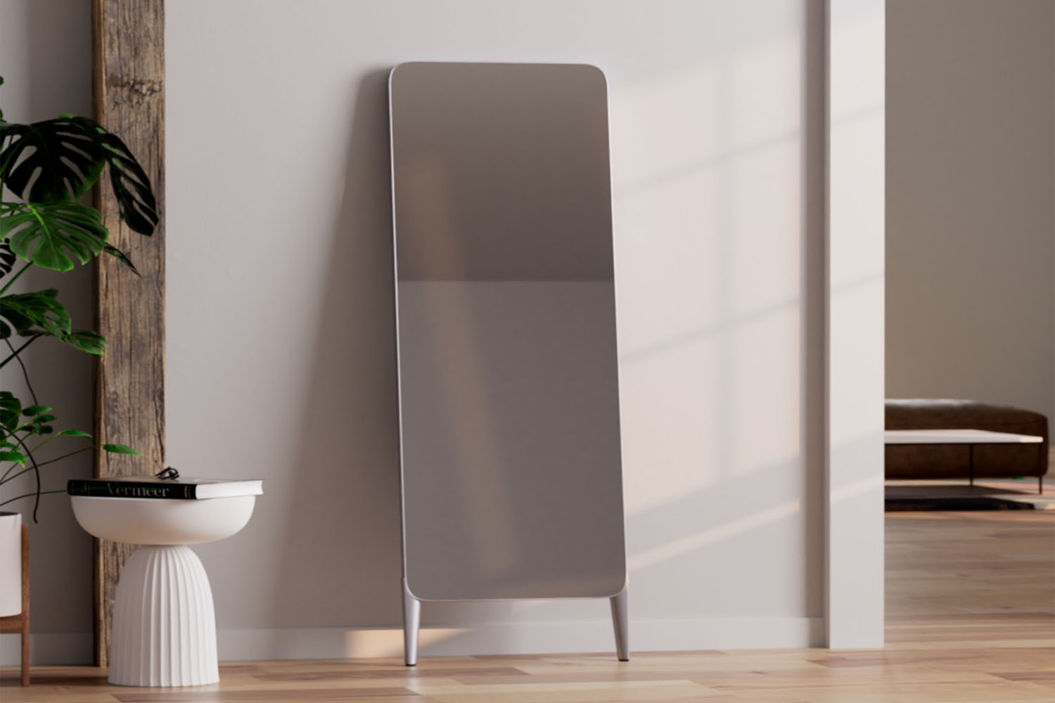 The FITURE Mini Interactive Fitness Mirror on a gray background