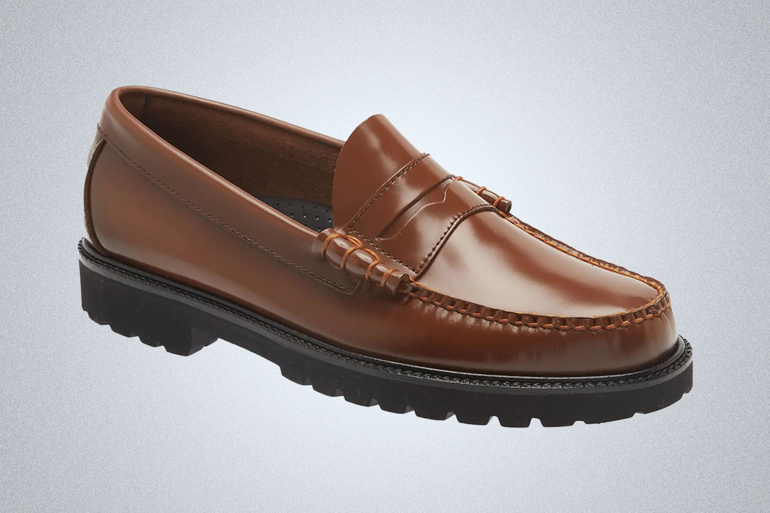 A brown lug sole loafer from G.H. Bass on a grey background