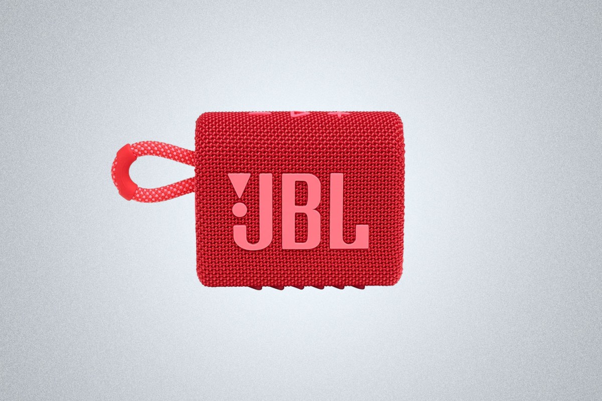 The JBL Go 3 Portable Speaker in red on a gray background