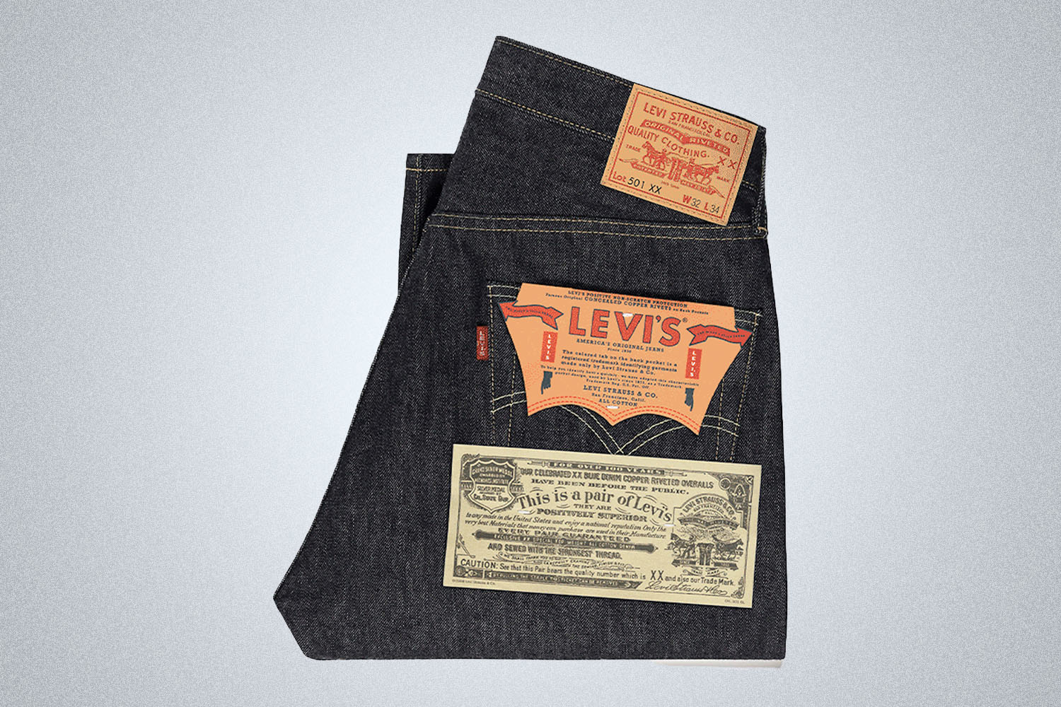 a pair of deadstock 1963 Levi's 501 Jeans on a grey background