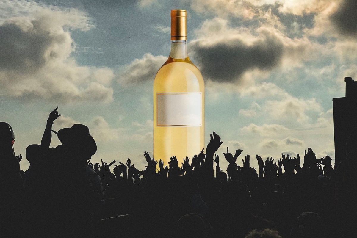 A Magnum sized bottle of wine in front of a festival -- magnums have more advantages than just a bigger size