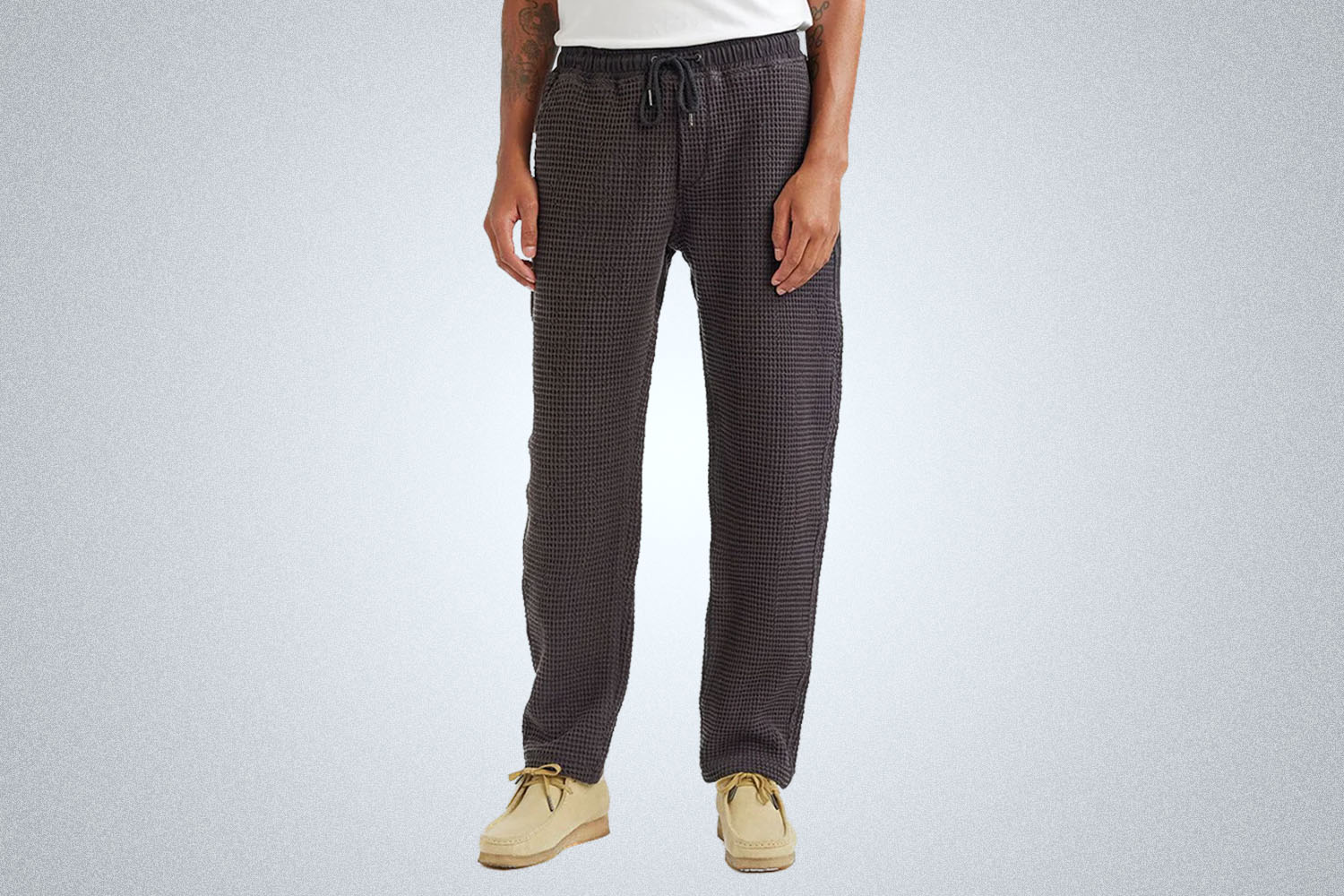 a model in a pair of Percival Everyday Waffle Sweatpants on a grey background