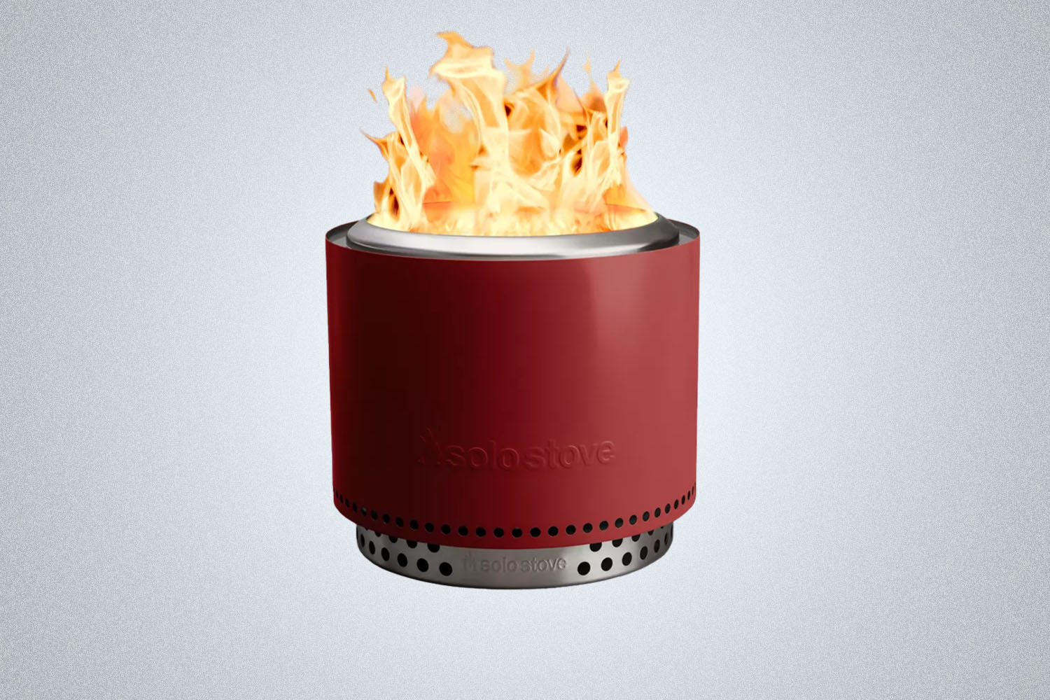 The Solo Stove Yukon + Stand 2.0 in red on a gray background